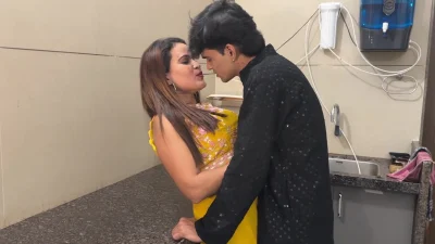 The beautiful wife was cooking in the kitchen when the husband came and started having sex in the kitchen itself.